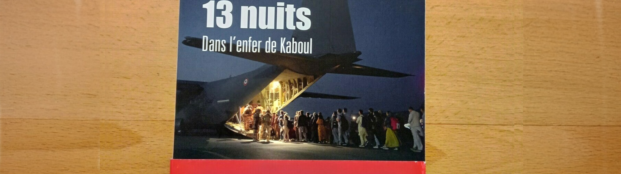 View of Mohamed BIDA's book "13 jours 13 nuits dans l'enfer de Kaboul" on a table