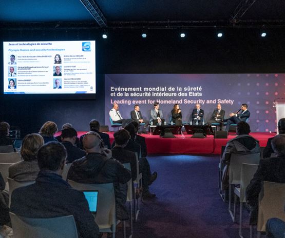 Expert panel on homeland security during Milipol Paris, with an attentive audience in the conference room.